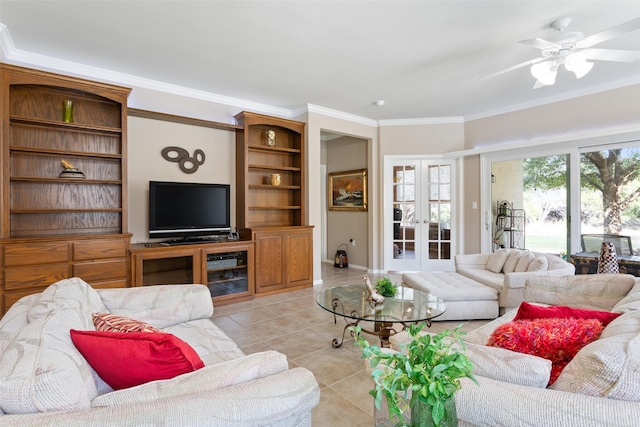 tiled living room featuring french doors, ceiling fan, and ornamental molding