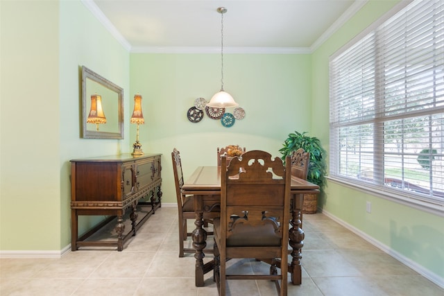 dining room featuring ornamental molding and light tile patterned floors