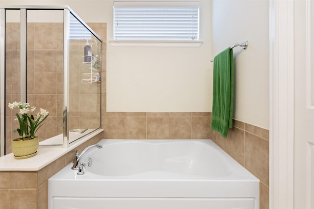 bathroom with shower with separate bathtub