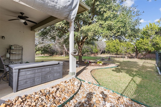 view of yard with ceiling fan