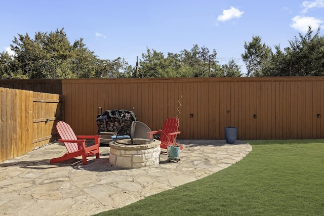 view of patio / terrace featuring a fire pit