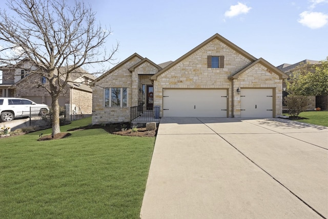 view of front of property featuring a front lawn and a garage