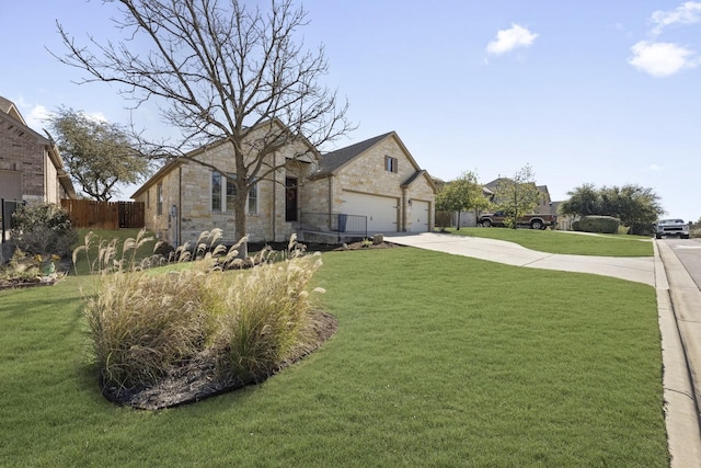 view of front of house with a front yard and a garage