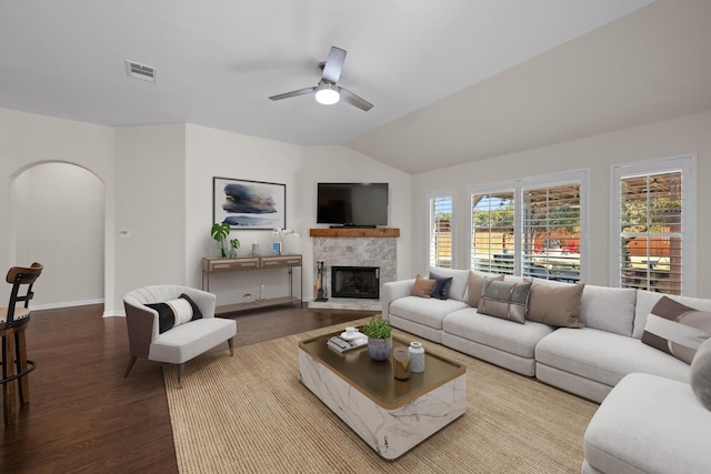 living room featuring ceiling fan, light hardwood / wood-style flooring, and vaulted ceiling