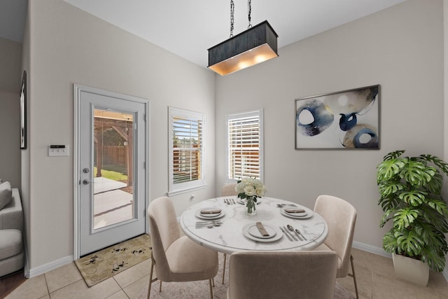 dining area featuring light tile patterned floors