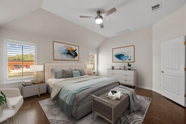 bedroom featuring ceiling fan, dark hardwood / wood-style flooring, and lofted ceiling