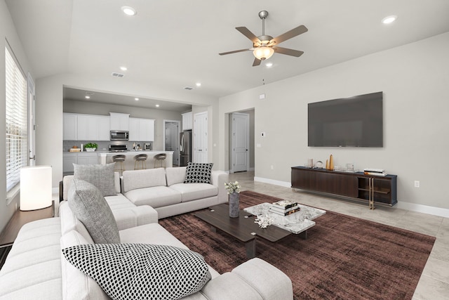 living room featuring ceiling fan