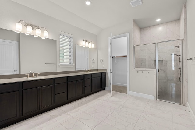 bathroom with vanity and a shower with shower door