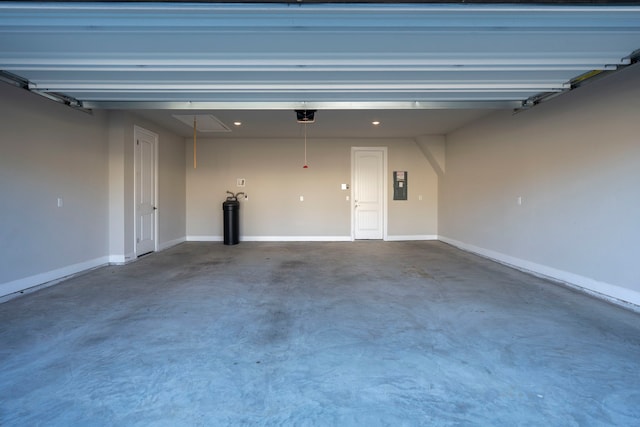 garage featuring a garage door opener and electric panel