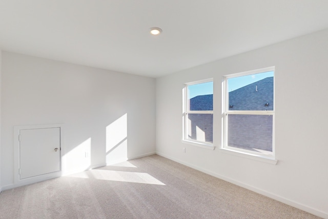 empty room featuring light carpet