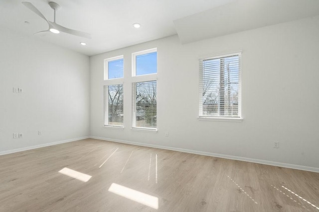 unfurnished room featuring ceiling fan and light hardwood / wood-style floors