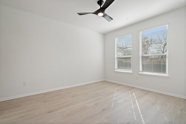 empty room featuring ceiling fan and light wood-type flooring