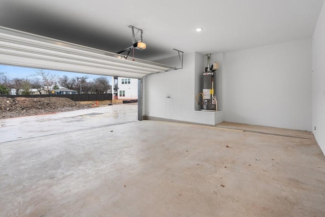 garage featuring a garage door opener and gas water heater