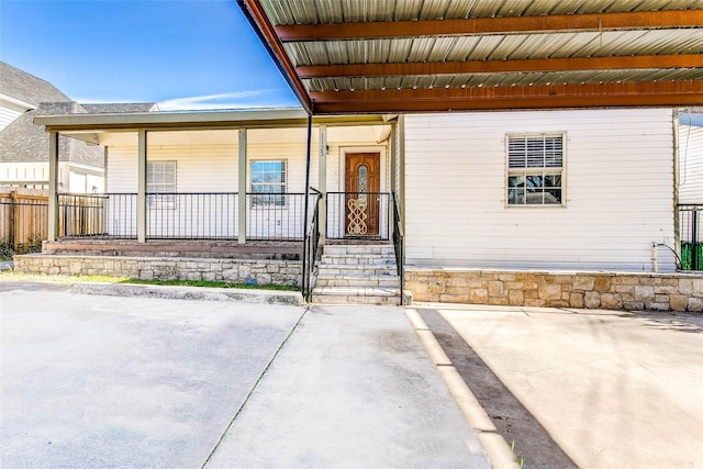 doorway to property featuring a patio