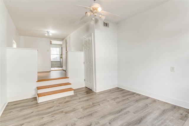 unfurnished room featuring ceiling fan and light hardwood / wood-style flooring