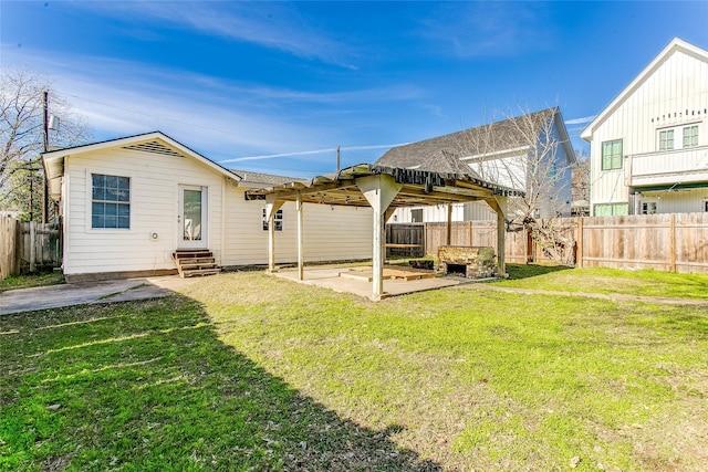 rear view of property with a pergola, a patio, and a lawn