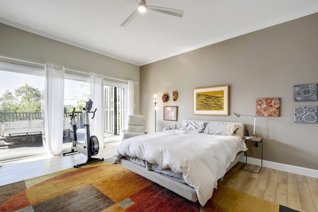 bedroom with ceiling fan, access to outside, crown molding, and wood-type flooring