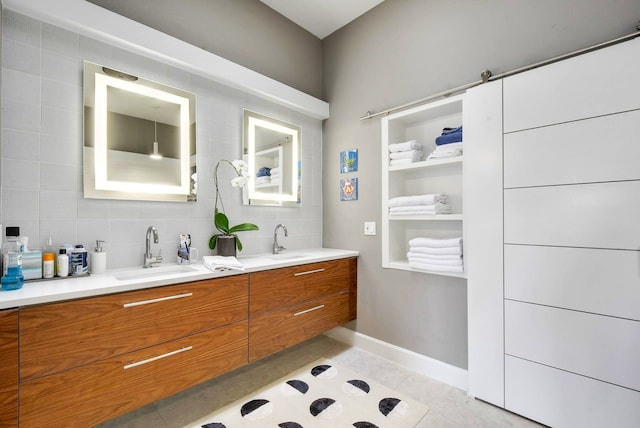 bathroom featuring tile patterned flooring, tasteful backsplash, and vanity