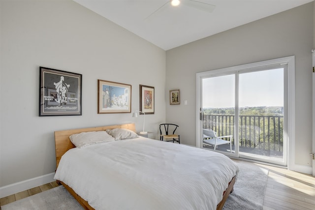 bedroom featuring lofted ceiling, access to exterior, ceiling fan, and light wood-type flooring