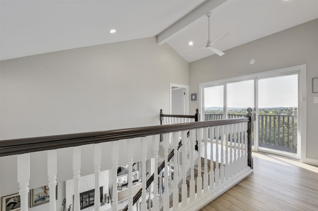 hall featuring lofted ceiling with beams and light hardwood / wood-style floors