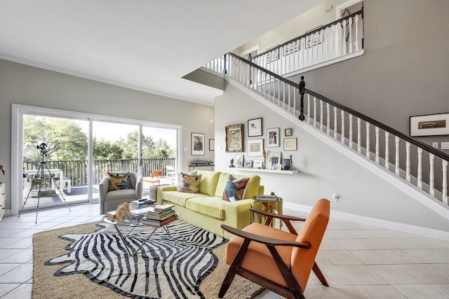 tiled living room featuring a high ceiling and ornamental molding