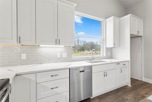 kitchen featuring sink, dark wood-type flooring, white cabinetry, stainless steel appliances, and light stone countertops