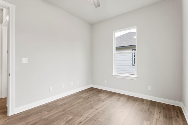 unfurnished room featuring hardwood / wood-style flooring and ceiling fan