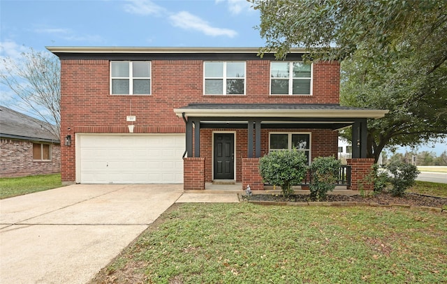 view of front of house with covered porch, a front yard, and a garage