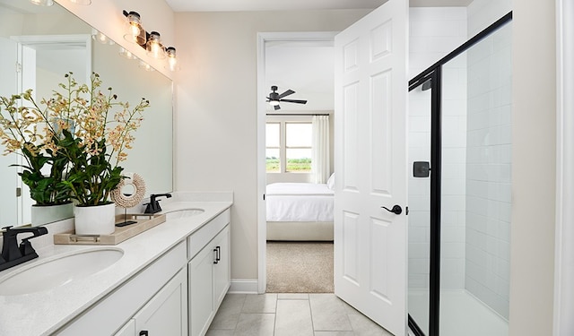 bathroom with tile patterned flooring, vanity, ceiling fan, and a shower with shower door