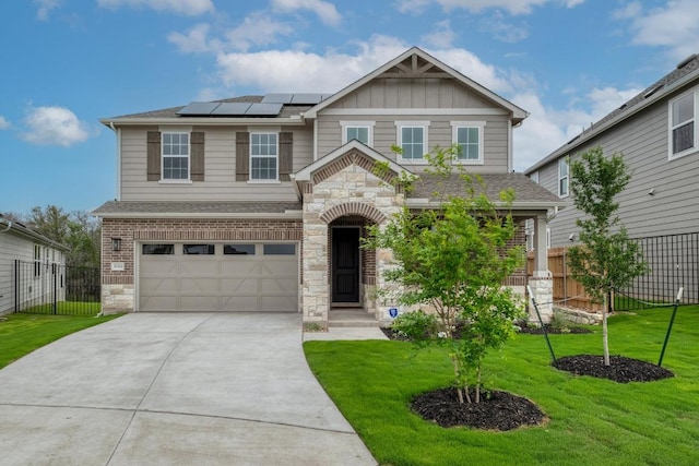 16904 Astral Ln, Manor, TX 78653 - craftsman-style house featuring stone siding, a garage, driveway, roof mounted solar panels, and board and batten siding