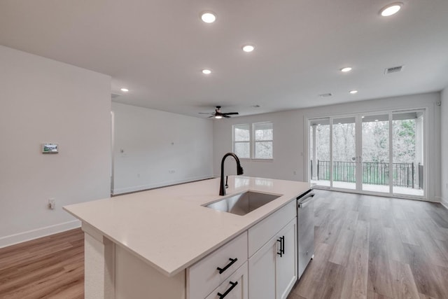 16904 Astral Ln, Manor, TX 78653 - kitchen with open floor plan, light wood-style floors, a ceiling fan, recessed lighting, and light countertops