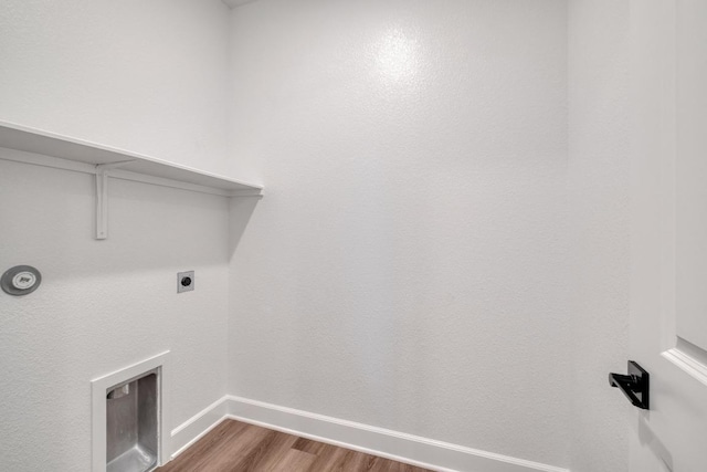 16904 Astral Ln, Manor, TX 78653 - washroom featuring electric dryer hookup and dark wood-style flooring