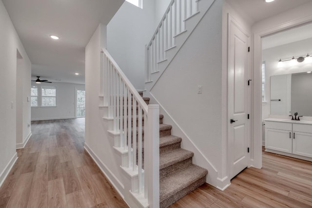 16904 Astral Ln, Manor, TX 78653 - stairway featuring wood finished floors, recessed lighting, and a ceiling fan