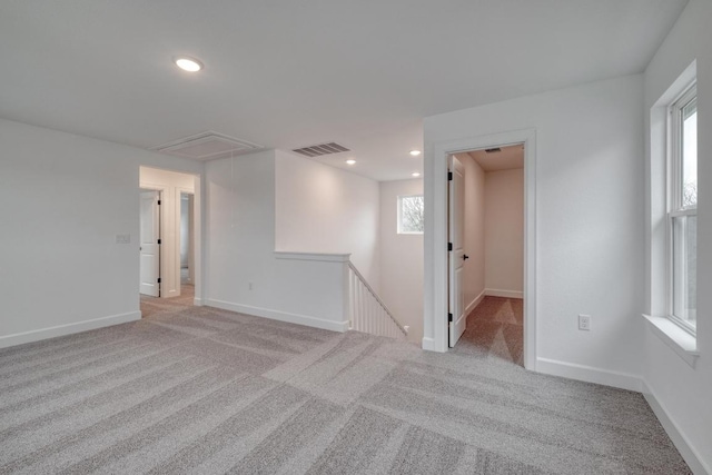 16904 Astral Ln, Manor, TX 78653 - empty room with attic access, light colored carpet, recessed lighting, and plenty of natural light