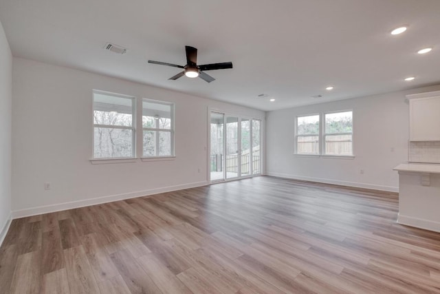 16904 Astral Ln, Manor, TX 78653 - unfurnished living room featuring a ceiling fan, light wood-type flooring, and recessed lighting