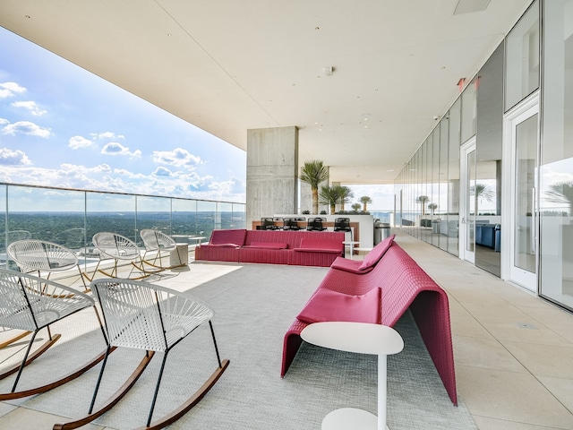 view of patio / terrace featuring a balcony and an outdoor living space