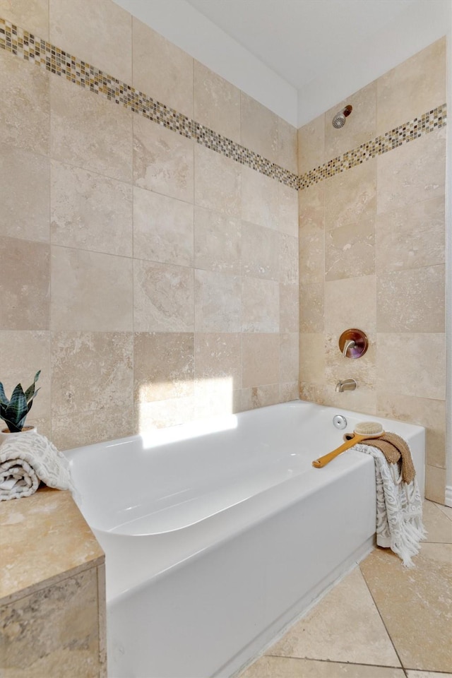 bathroom featuring a washtub and tile patterned flooring