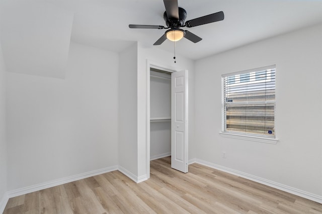 unfurnished bedroom featuring a closet, ceiling fan, and light hardwood / wood-style flooring