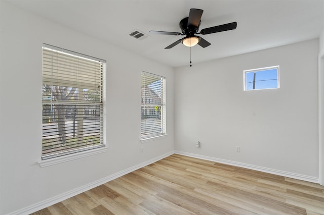 spare room with ceiling fan and light hardwood / wood-style flooring