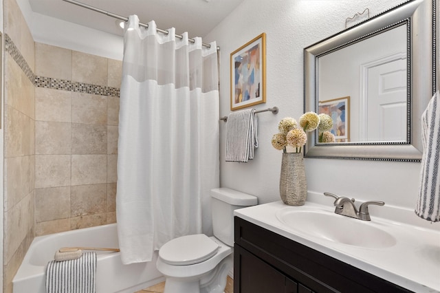 full bathroom with shower / tub combo, vanity, and toilet