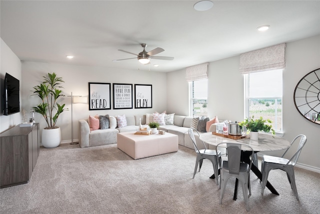 living room featuring ceiling fan and light carpet