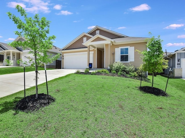 view of front of house with a front lawn and a garage