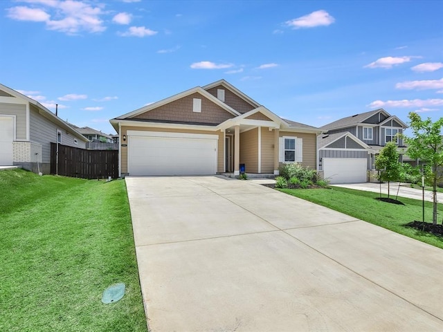 view of front of property featuring a front lawn and a garage