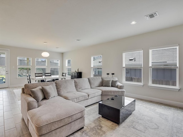 living room featuring light tile patterned flooring