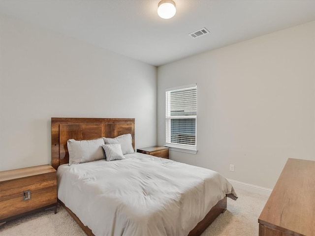 bedroom featuring light colored carpet