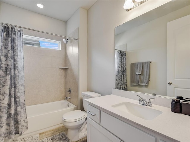 full bathroom featuring toilet, vanity, and shower / bath combo