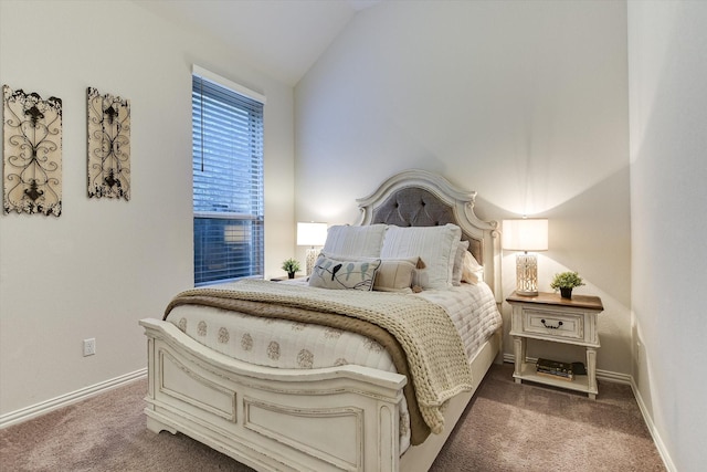 carpeted bedroom with lofted ceiling