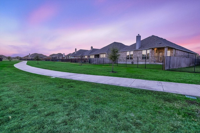 view of yard at dusk