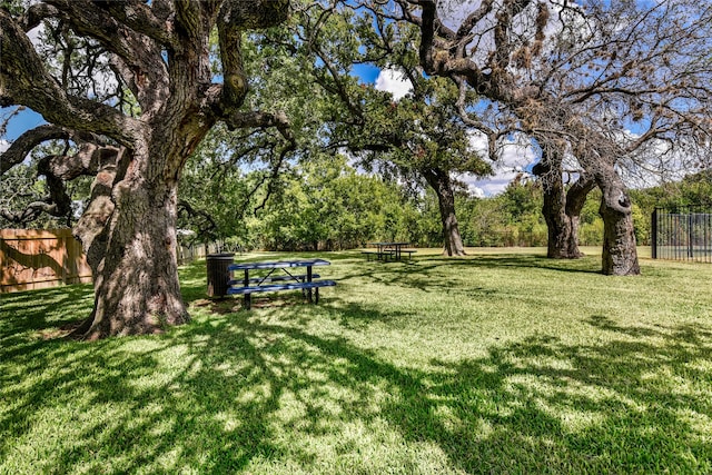 view of home's community with a yard