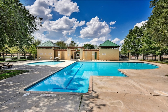 view of pool featuring a patio